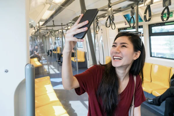 Asian woman using mobile phone