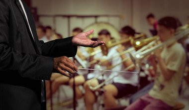 Orchestra conductor hands leading 