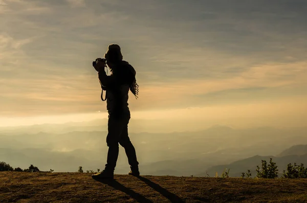 Photographer taking picture of mountain — Stock Photo, Image