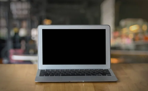 Laptop on wooden table — Stock Photo, Image