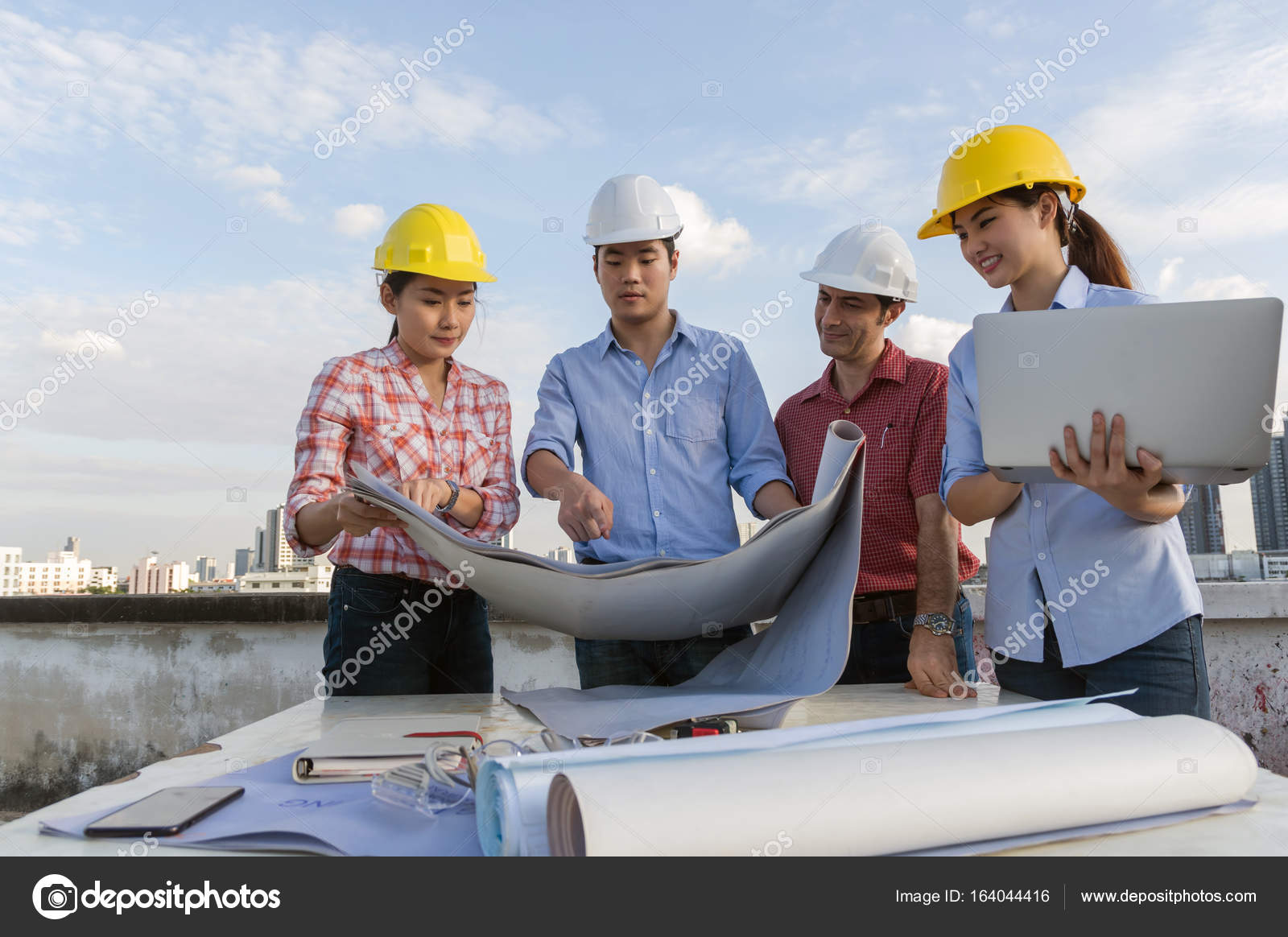 Group of professional engineers with blueprints — Stock Photo © Tzido