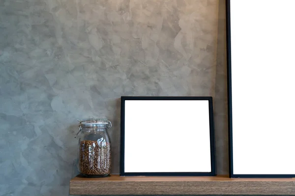 Empty photo frame and coffee in jar — Stock Photo, Image