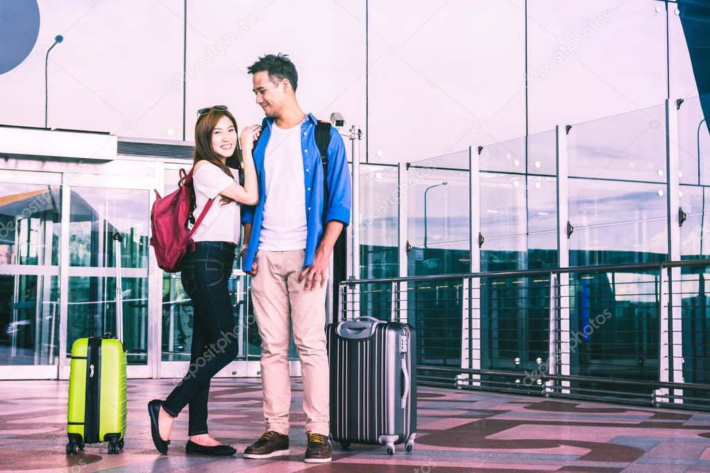 Asian couple traveler with suitcases 