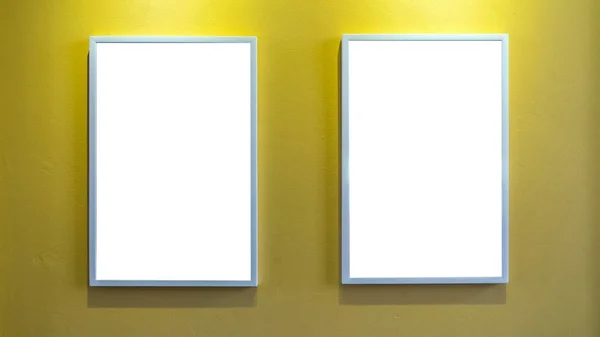 Photo frames over yellow wall — Stock Photo, Image