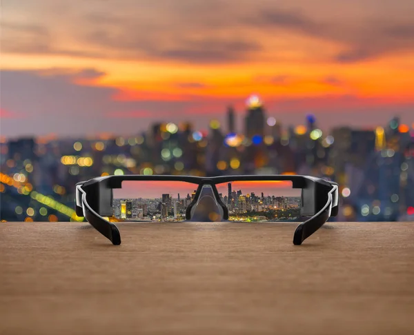 Cityscape focused in glasses — Stock Photo, Image
