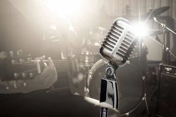 Retro microphone over musician — Stock Photo, Image