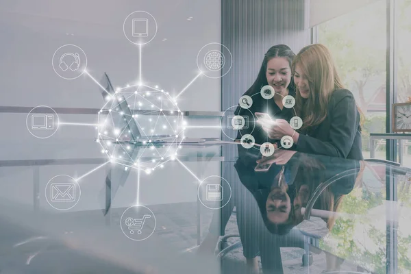 Two Asian Businesswomen using laptop — Stock Photo, Image