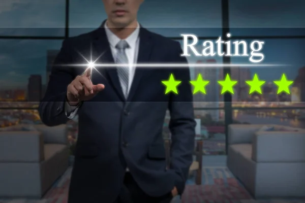 Businessman pointing five star button — Stock Photo, Image