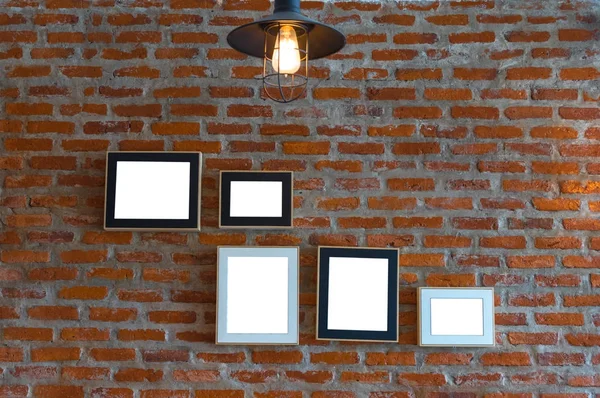 Photo frames over the brick — Stock Photo, Image