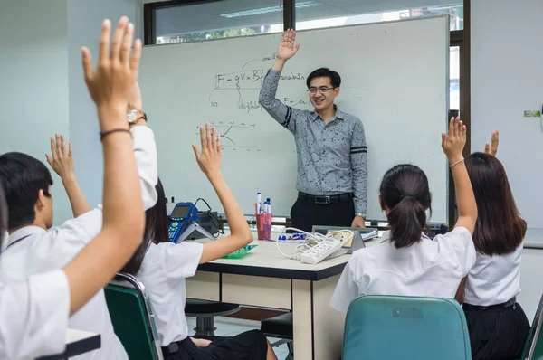 Asian teacher Giving Lesson