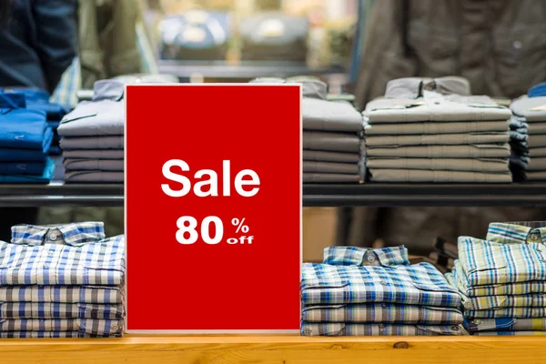 sale 80 off mock up advertise display frame setting over the stack of jeans and clothes line in the shopping department store for shopping, business fashion and advertisement concept0 off mock up advertise display frame setting over the stack of shir