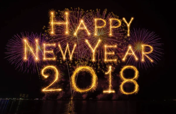 Happy new year 2018 written with Sparkle firework on fireworks with dark background, celebration and greeting cards concept