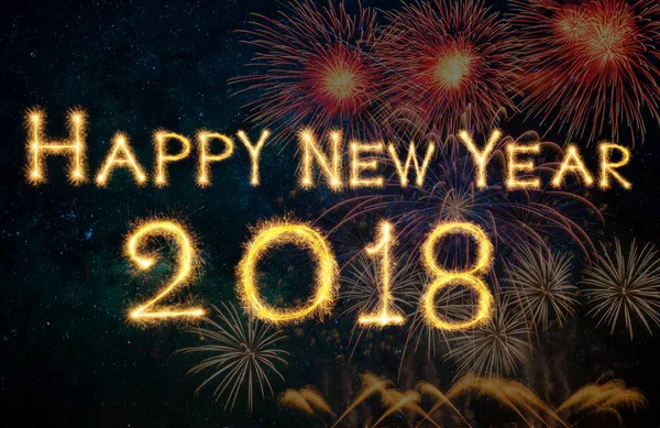 Happy new year 2018 written with Sparkle firework on fireworks with dark background, celebration and greeting cards concept