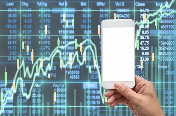 Female hand holding mobile smart phone touch screen showing white background for insert text and picture over the Stock market exchange data on LED display,Business financial and technology concept