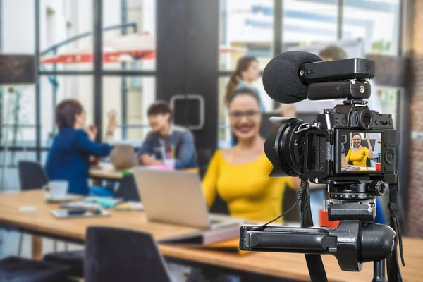 Professional digital Mirror-less camera with microphone recording video blog of Businesswoman working with Group Of Business people. Camera for photographer or Video and Live Streaming concept