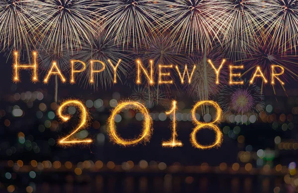 Happy new year 2018 written with Sparkle firework on fireworks with dark background, celebration and greeting cards concept