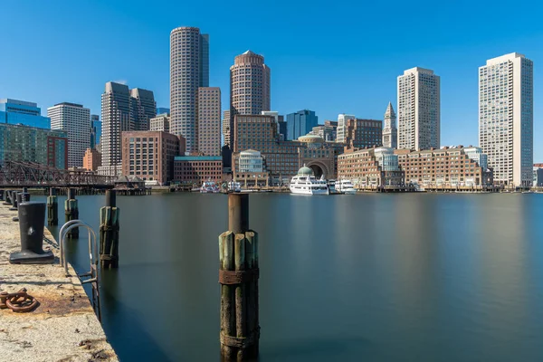 Boston skyline from Fan Pier at the afternoon with smooth water river, Massachusetts, USA downtown skyline, United state of America, Architecture and building with tourist concept