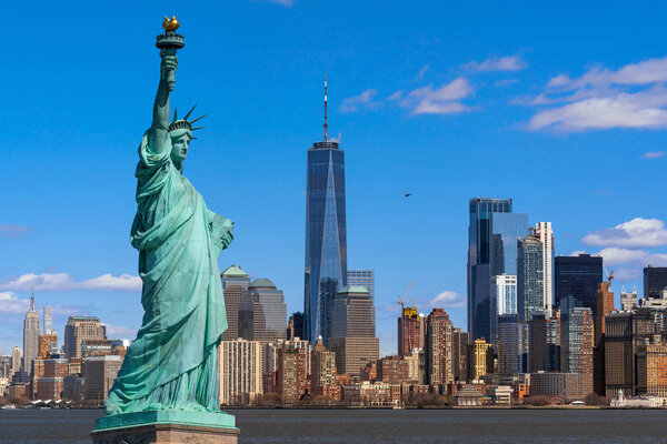 The Statue of Liberty over the Scene of New york cityscape river side which location is lower manathan, Architecture and building with tourist concept