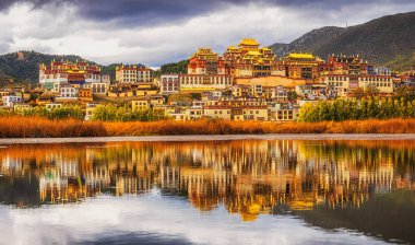 Panorama scene of Songzanlin Temple, is Tibetan Buddhist monastery in Zhongdian city, Shangri-La, Yunnan province, China, travel and tourists,famous place and landmark,religious and holiday concept clipart