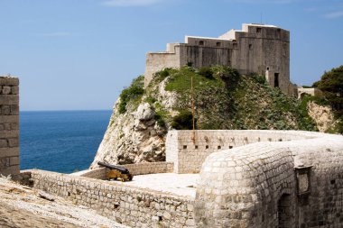 Fortress St. Lawrence often called Dubrovnik's Gibraltar a fortress and theater outside the western wall of the old city of Dubrovnik in Croatia with the Adriatic Sea clipart