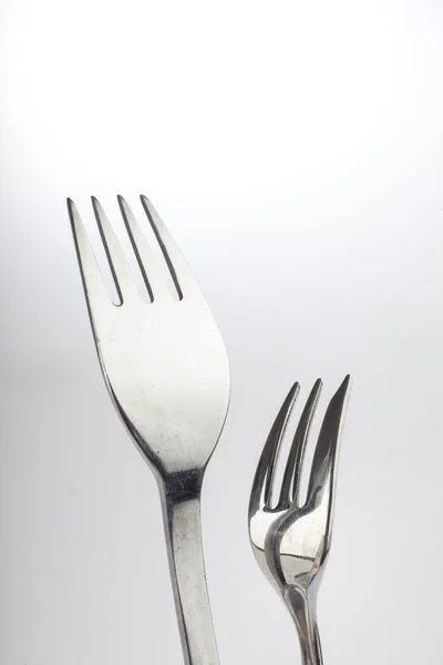 Reflexão sobre dois garfos — Fotografia de Stock