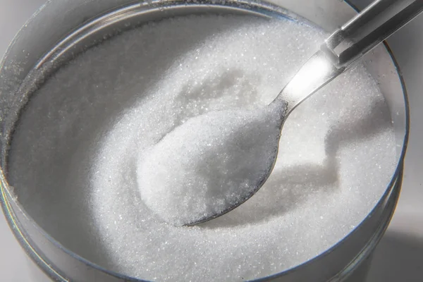 Sugar in a bowl taken out — Stock Photo, Image