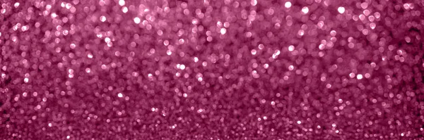 Pink bokeh sparkles background.