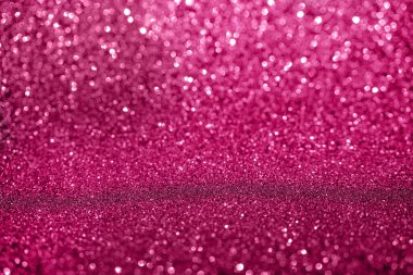 Pembe bokeh ışıldar arkaplan.