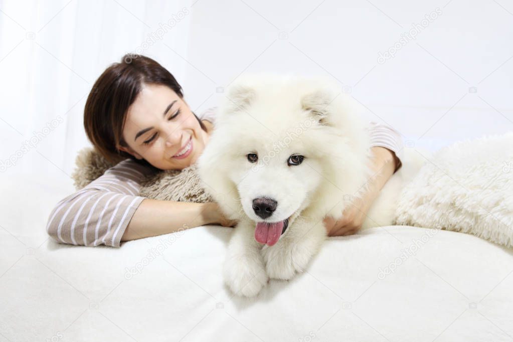 Smiling woman with pet dog 