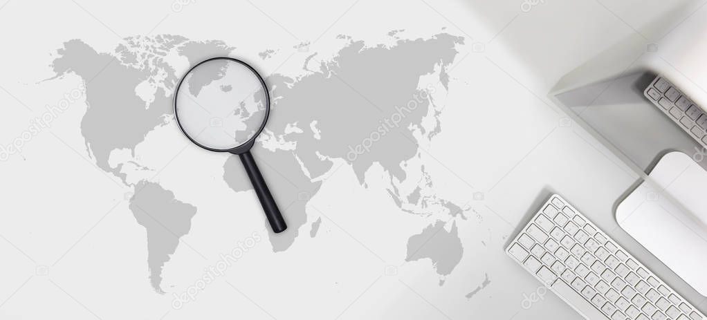 searching concept, magnifying glass with international map 