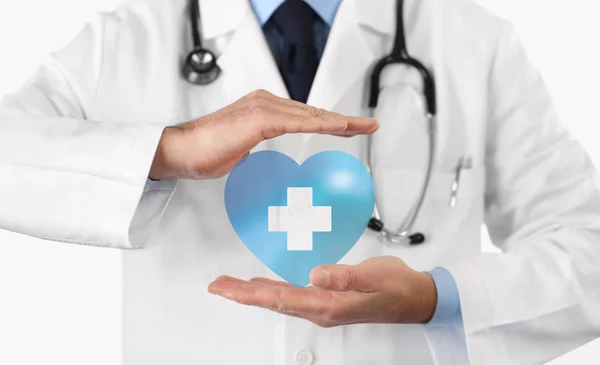 Medical health insurance concept, cross and heart symbol — Stock Photo, Image