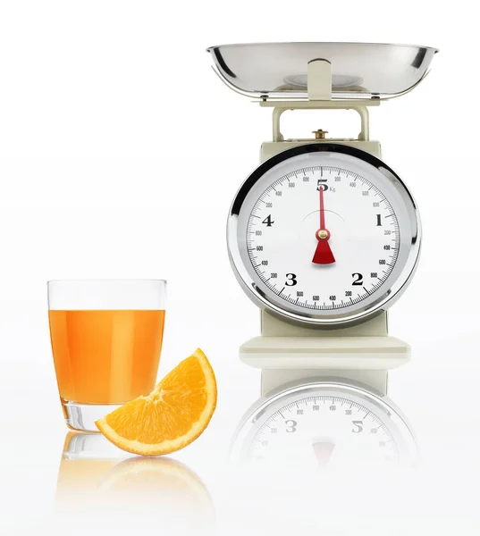 Food scale with orange juice glass isolated on white background, — Stock Photo, Image