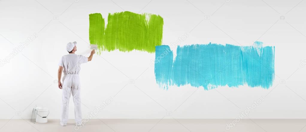 painter man with paint brush painting colors samples, isolated o