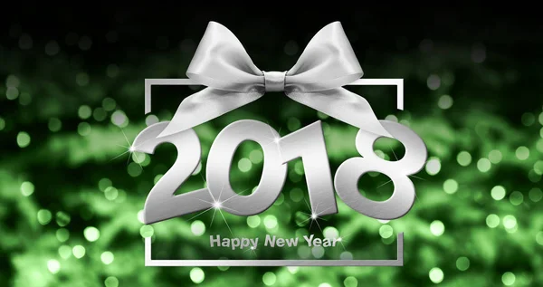 Happy new year text in box frame with silver ribbon bow on green — стоковое фото