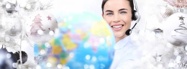 International christmas smiling woman with globe and headset on — Stock Photo, Image