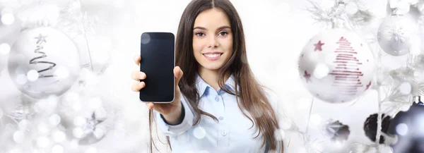 Christmas theme woman with smart phone smiling isolated on chris — Stock Photo, Image