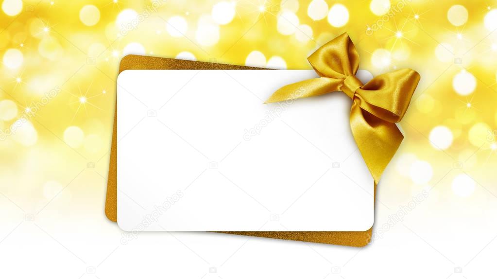 christmas greeting gift card with ribbon bow on golden lights ba