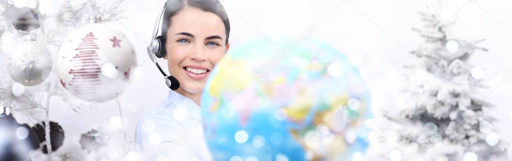 international christmas smiling woman with globe and headset on 