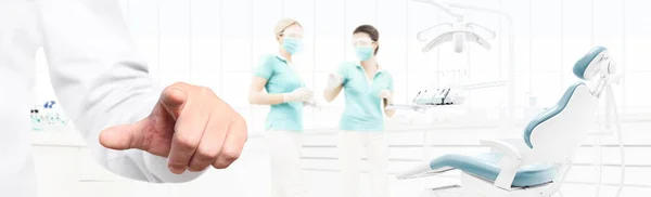 Dentist hand touch screen on dental clinic with dentist's chair — Stock Photo, Image