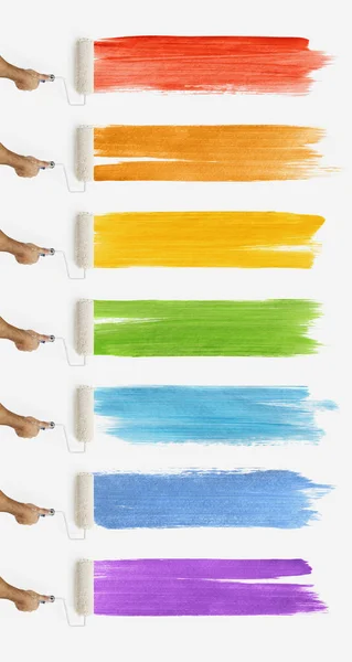 Mão com pintura de rolo na parede com amostras de cores, banner web t — Fotografia de Stock