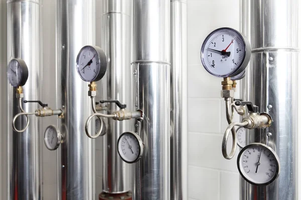 Manometer, pipes and faucet valves of heating system in a boiler — Stock Photo, Image