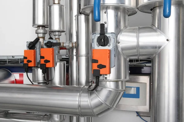 Pipes and faucet valves of heating system in a boiler room — Stock Image Pipes and faucet valves of heating system in a boiler room Stock Photo