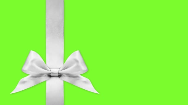 メリークリスマスギフトカードリボンの弓はコピースペースと緑の画面の背景テンプレートに隔離された色を変更します — ストック動画