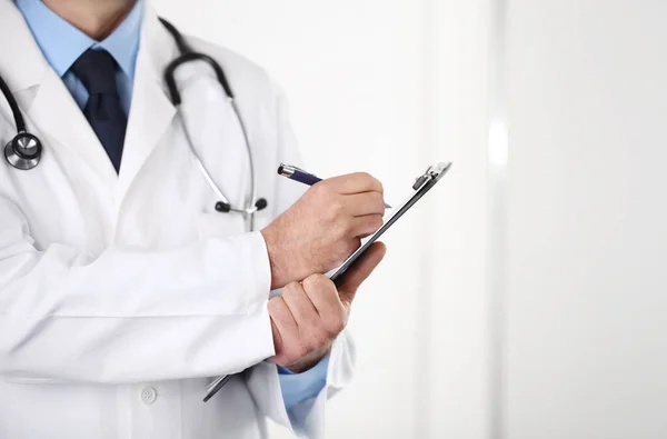 Close Doctor Hand Writing Prescription Folder Isolated White Background — Stock Photo, Image