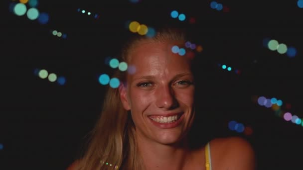 PORTRAIT: Colorful soap bubbles flying around the gorgeous young woman's face. — Stock Video