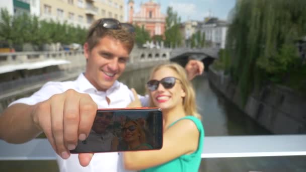 SLOW MOTION: Young couple waving at the camera while skyping from Slovenia. — Stock Video