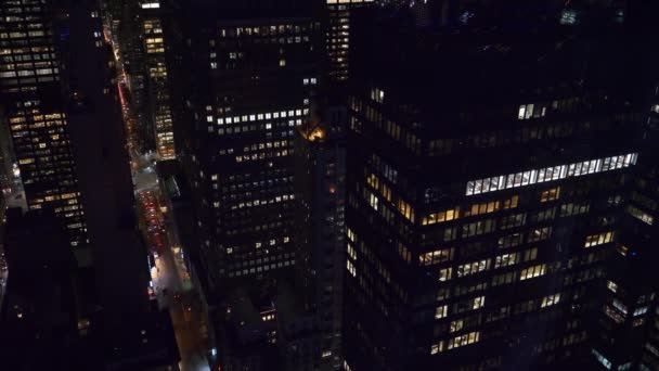 Workers in corporate offices stay up late to extend their workday in busy city. — Stock Video