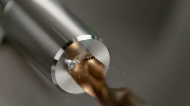 MACRO: Lathe tool spot drilling a hole into a cylinder shaped piece of aluminium — Stock Video