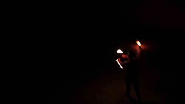 Fire breather on a black background — Stock Video