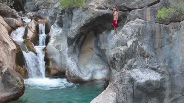 Man is Jumping Into the River Waterfall — Stock Video